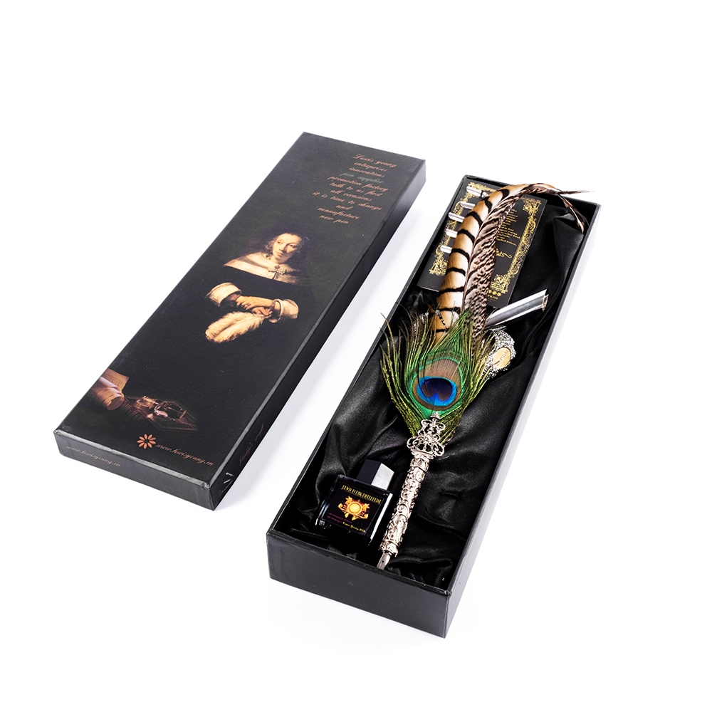 Calligraphy dip pen with a peacock quill and nibs, metallic stand and ink